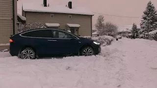 Driving Tesla Model X through deep snow
