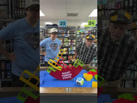 It's Chris vs. Mike in the dexterity game challenge of the century.