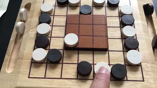 Trinidad. Another wooden abstract, checkers-type game from the early 2000s.