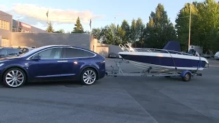 Tesla Model X towing a boat