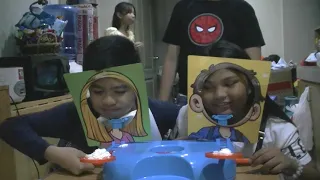 Children play Wacky Face (Pie Face) game