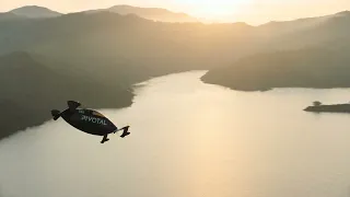 Pivotal aircraft flying over lake in Southern California.