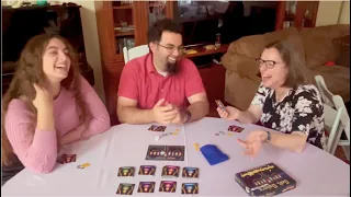 Laughter abounds as a trio playtests Gelt Galore: Pocket Edition