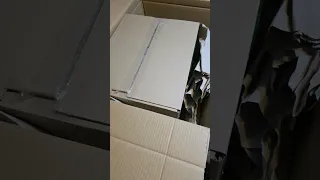 Opening a carton of Here Comes a Candle