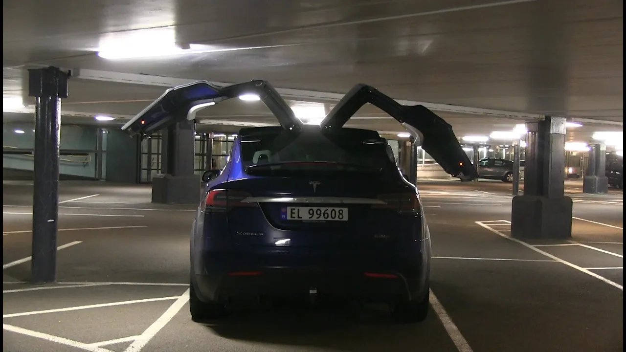 Opening falcon wing doors in garage