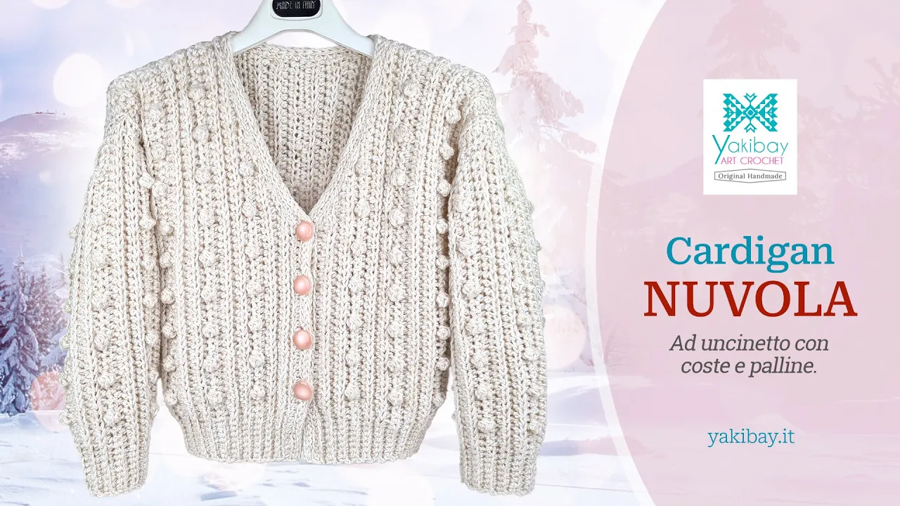 Cárdigan Nuvola a crochet en blanco crema, con canalé, puntos popcorn, manga larga y escote en V.